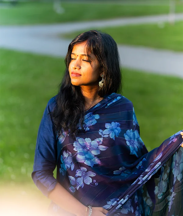 Jessy in a blue floral dupatta, eyes closed